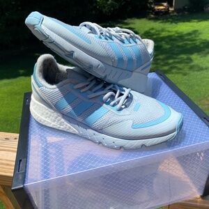 Blue Adidas sneakers.